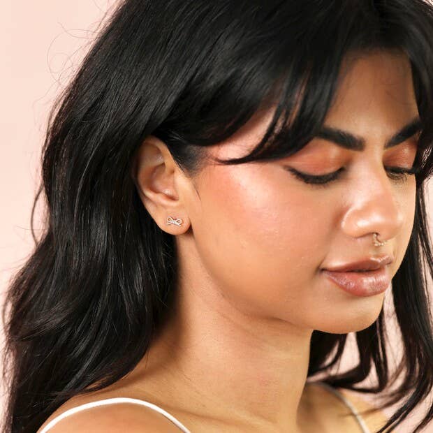 Sterling Silver Twisted Bow Stud Earrings